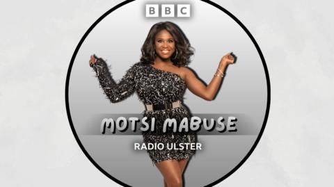 Motsi Mabuse poses in a sparkly black dress