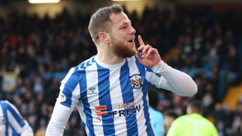 Bruce Anderson celebrates