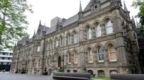 A large grand looking rectangular building which is the home of MIddlesbrough Council. It has dozens of windows and a number of turrets  