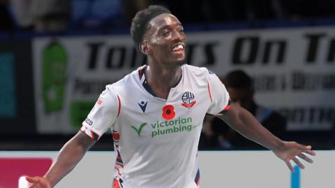 Amario Cozier-Duberry spreads his arms to celebrate a goal against Port Vale