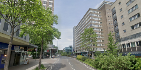 Tall concrete buildings next to Maid Marian Way in Nottingham