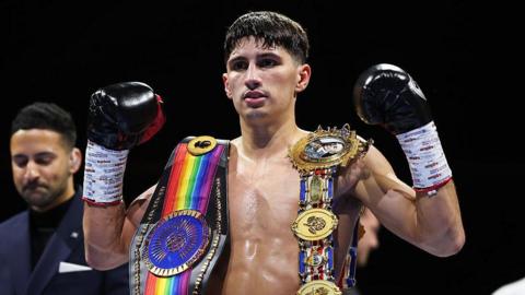 Royston Barney-Smith poses with his belts after winning in Scotland