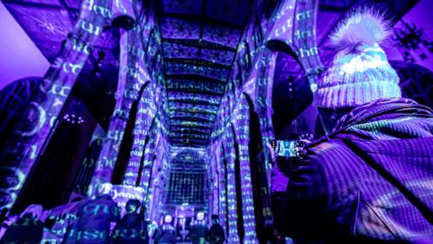 Purple lights in a building as part of The Elements show