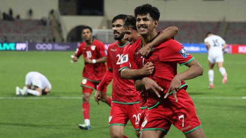 Oman celebrate a goal