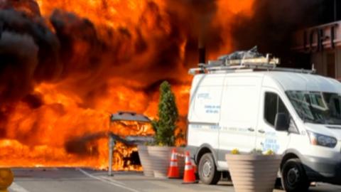 Moment a hybrid car catches fire and erupts into a huge fireball on a NYC street
