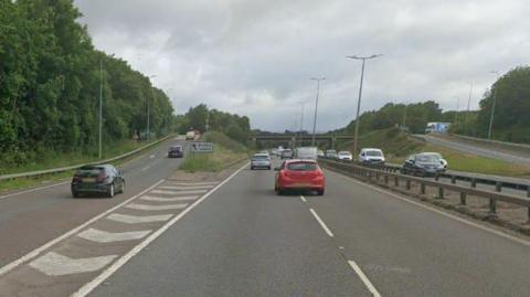 A47 motorway - with street lights in the middle of the road and on the side of the road 