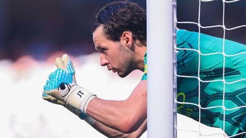 James Trafford offers a thumbs up as he lines up a wall