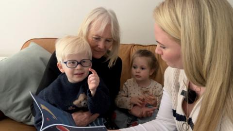 Gemma Stone reading The Man who Hung the Moon to two children