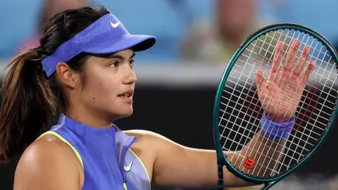 Emma Raducanu applauds the crowd