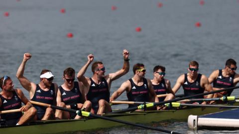 Paris 2024 Olympics - Rowing - Men's Eight Final A - Vaires-sur-Marne Nautical Stadium - Flatwater, Vaires-sur-Marne, France - August 03, 2024. Sholto Carnegie of Britain, Rory Gibbs of Britain, Morgan Bolding of Britain, Jacob Dawson of Britain, Charles Elwes of Britain, Tom Digby of Britain, James Rudkin of Britain and Tom Ford of Britain react after winning gold