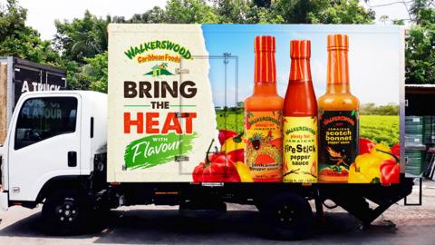 A lorry in Jamaica advertising hot sauces from local brand Walkerswood on the side of the vehicle
© Walkerswood