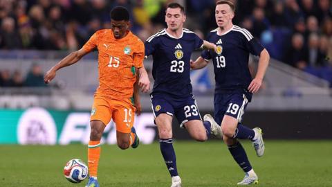 Scotland's Kenny McLean (centre) and Lewis Ferguson (right) in action against Ivory Coast