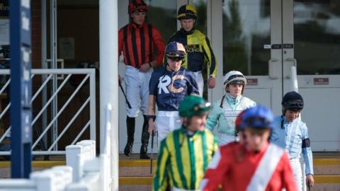 Jockeys going out for a race