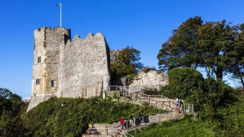 The winding steps leading up to Lewes Castle, which has a flag flying from its turret