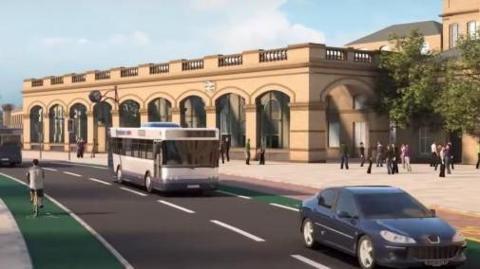 A digital impression of the front of York Station - a light brick building, with railway logo signage across the front. In front of the station is a road, with a bus, car and a bike.