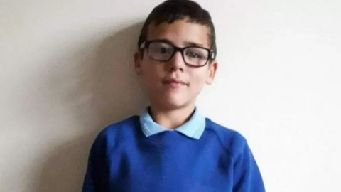 Alfie Steele in his blue school uniform and glasses before his death