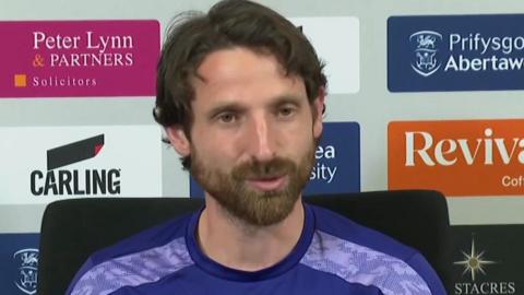 Joe Allen speaks to the media