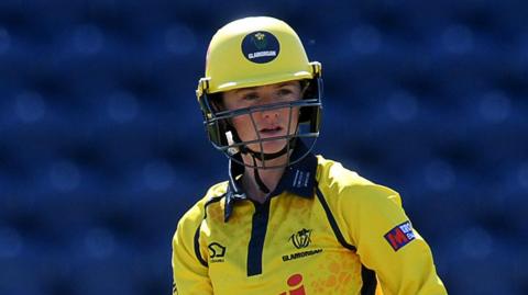 Bethan Ellis in action for Glamorgan in a yellow jersey