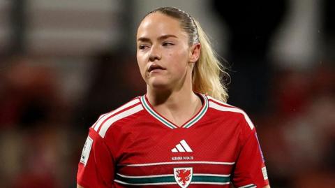 Phoebie Poole waits for the next action with Wales