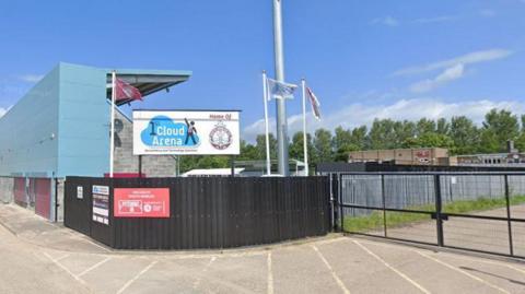 The Cloud Arena, home to South Shields FC, which has black fencing and turquoise stands.