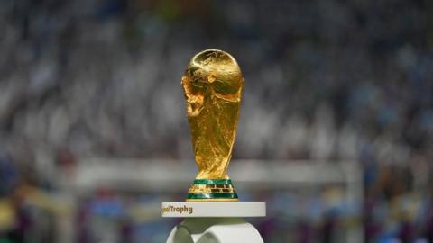 The Fifa World Cup trophy on a plinth