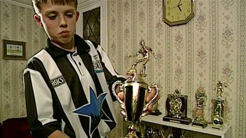 13-year-old Michael Carrick showing off a trophy