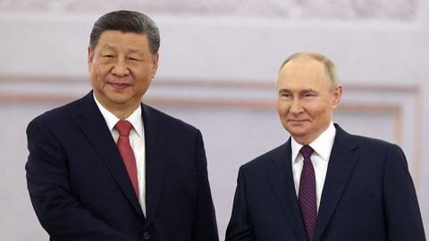 Putin (R) and Xi Jinping (L)
