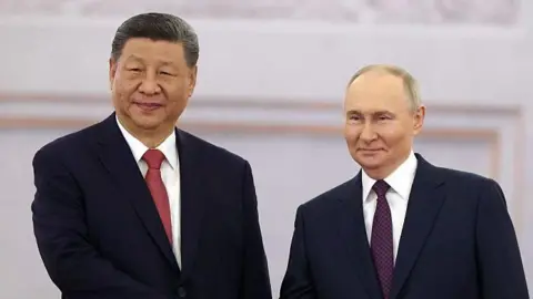 Putin (R) and Xi Jinping (L)