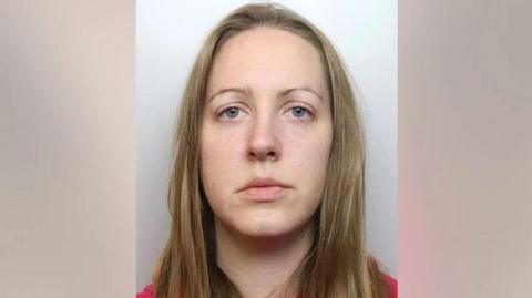 A police mugshot of Lucy Letby who has straight blonde hair and stares into the camera with a blank expression.