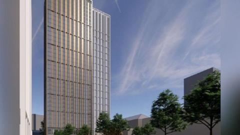 An architect projection of the building set against a blue sky with sun glinting off the surfaces. People are cycling on paths between trees in the grounds.