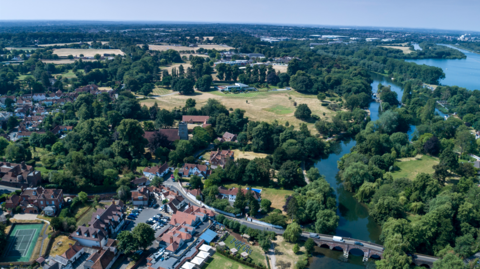 An aerial view of the River Thames, flowing past Sonning Village, located between Woodley and Caversham, in the Thames Valley, 3 miles east of Reading