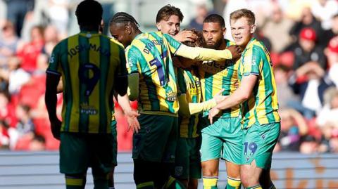 West Brom defender George Campbell celebrates with his teammates