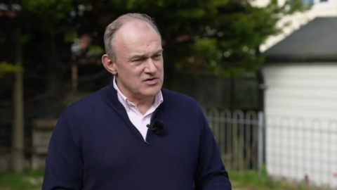 A man in a black jumper. 