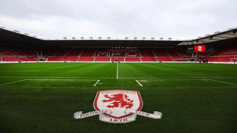 A view of the Riverside Stadium with Middlesbrough's badge on the artificial matting in front of the pitch