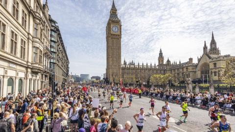 Runners in the London Marathon run past Big Ben