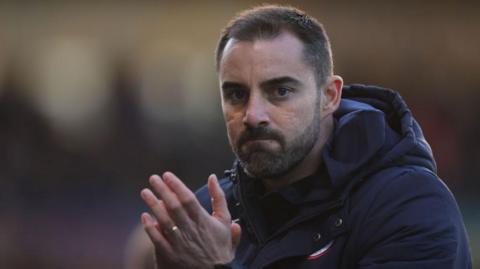 Reading boss Ruben Selles claps supporters. 