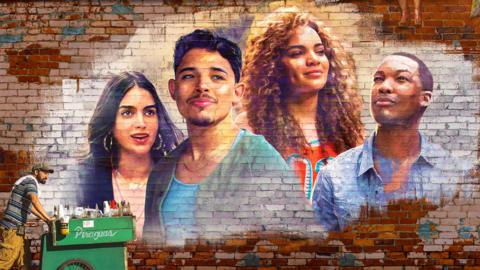 The faces of Melissa Barrera, Anthony Ramos, Ariana Greenblatt and Corey Hawkins spray painted on a brick wall