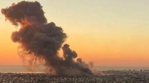 Smoke rises above Beirut's southern suburbs during an Israeli strike.