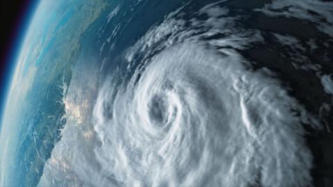 View of the world from space with a visible swirling weather pattern.