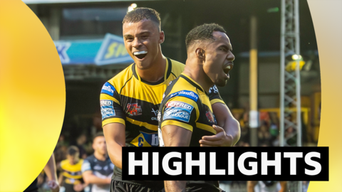 Castleford players celebrate a try against Hull FC