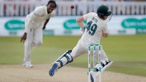 Australia batter Steve Smith ducks out of the way of a bouncer from England fast bowler Jofra Archer