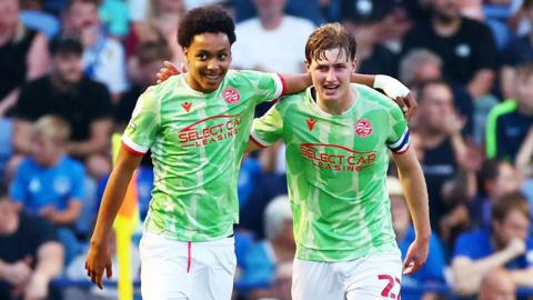 Reading's Andre Garcia celebrates with his teammate after scoring a goal 