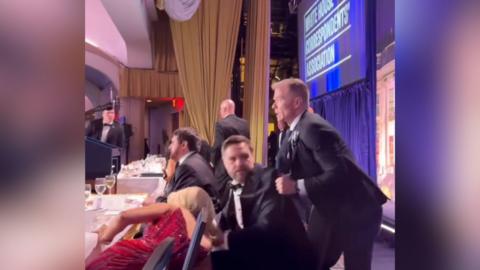 JD Vance being pulled off his chair