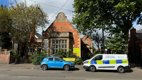 Police at the scene in Lenton Boulevard