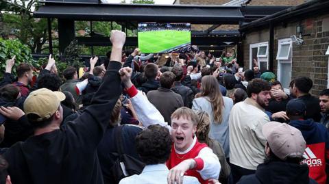 Arsenal fans celebrate