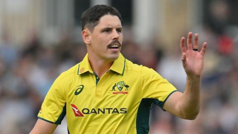 Ben Dwarshuis prepares to catch the ball thrown to him during a game for Australia against England last summer