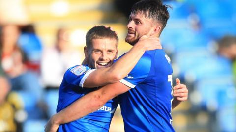 Chesterfield players celebrate a goal