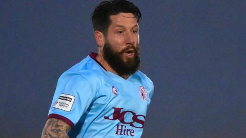 Midfielder Jacob Butterfield in action for Gateshead in their blue away jersey