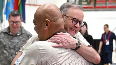 Australian Prime Minister Anthony Albanese receives a hug from Prime Minister of Tuvalu Feleti Teo