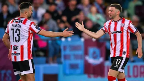 Dom Thomas (right) celebrates with Robbie Benson after hitting Derry's late equaliser in Drogheda